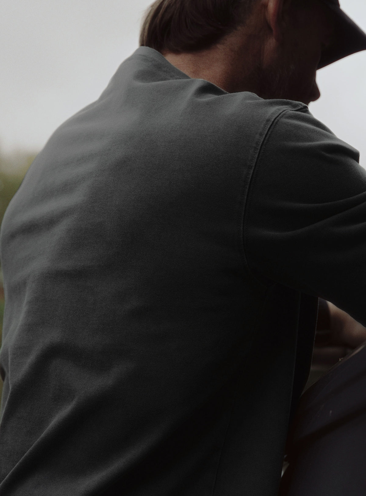 An in the field image of Dissident Washed T-Shirt in Obsidian Black (ITF)