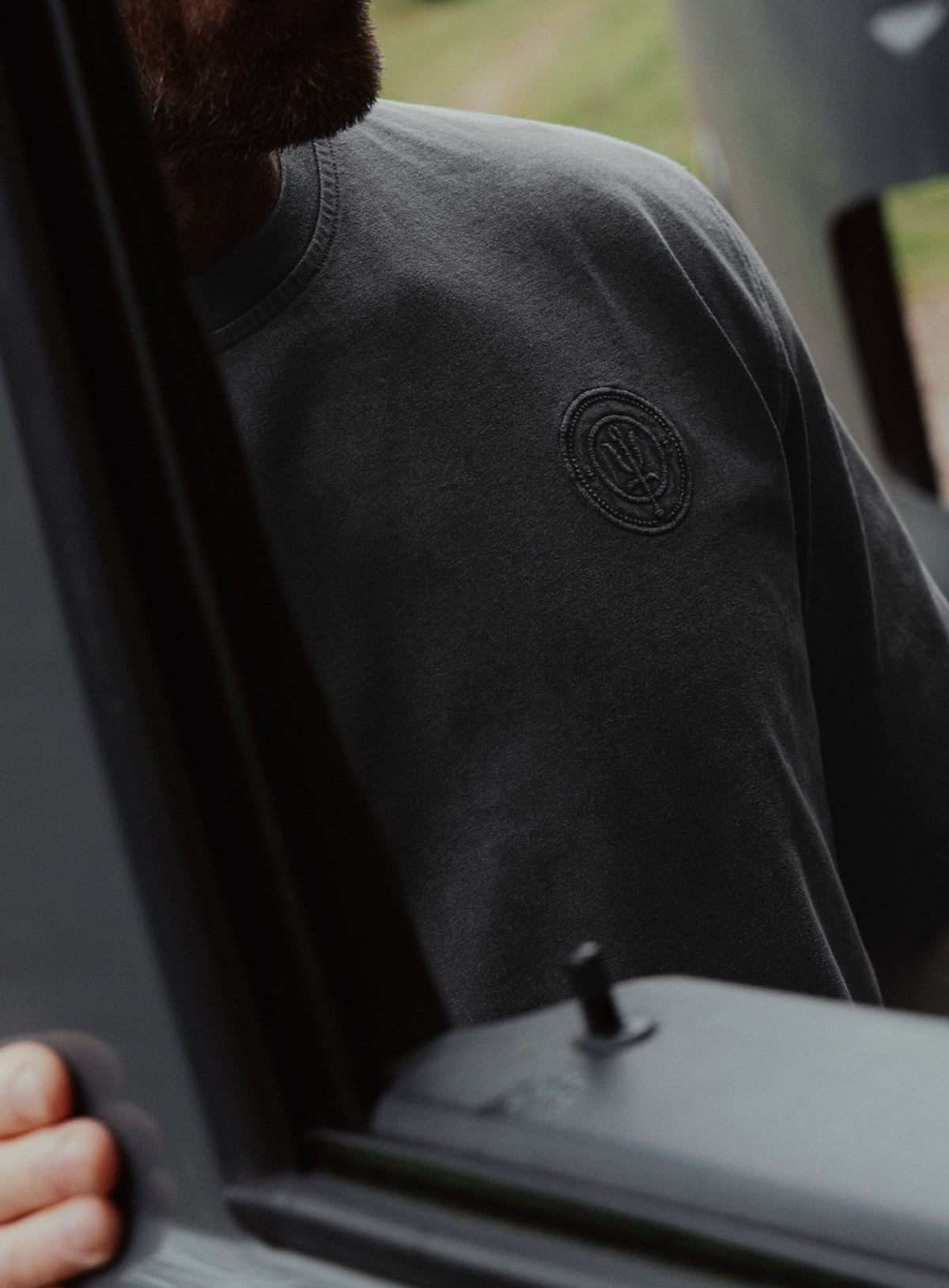 An in the field image of Dissident Washed T-Shirt in Obsidian Black (ITF)
