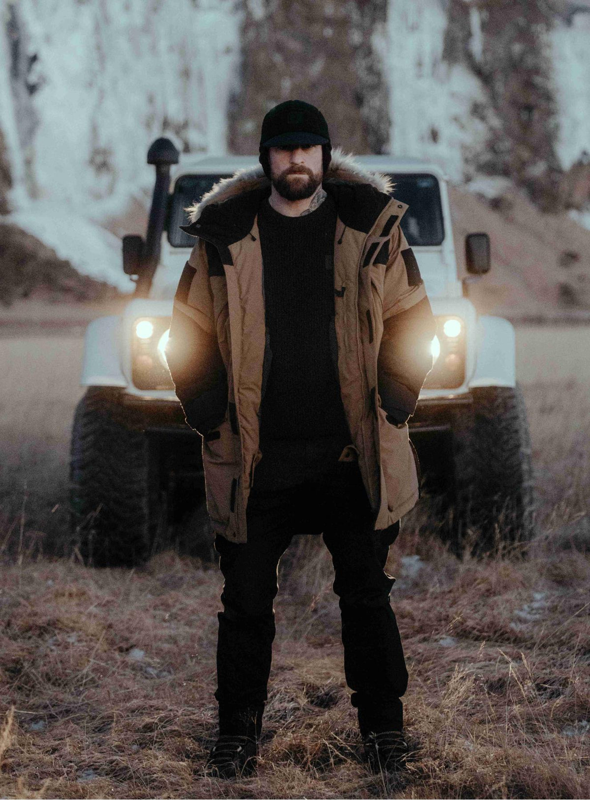 An in the field image of Men's End of Days Parka in Coyote Brown (ITF)