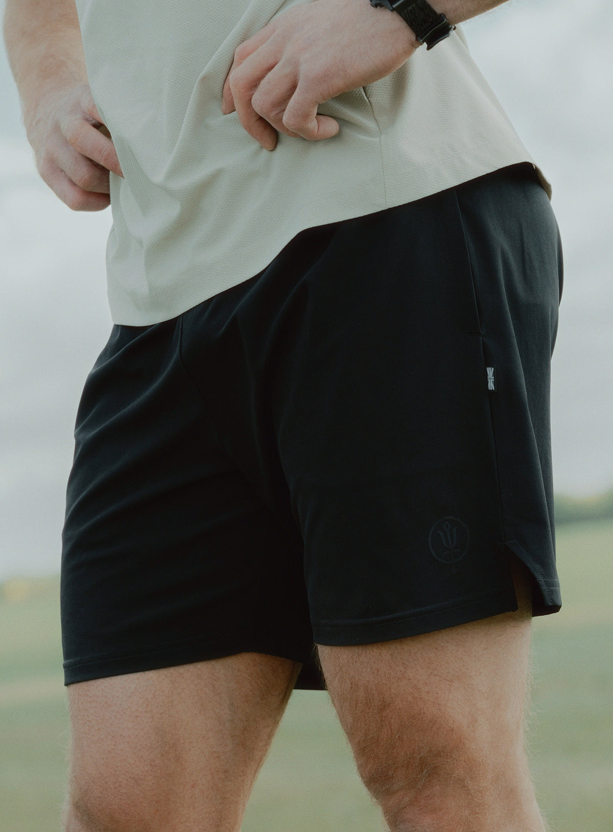 An in the field image of Force Motion Shorts in Obsidian Black (ITF)