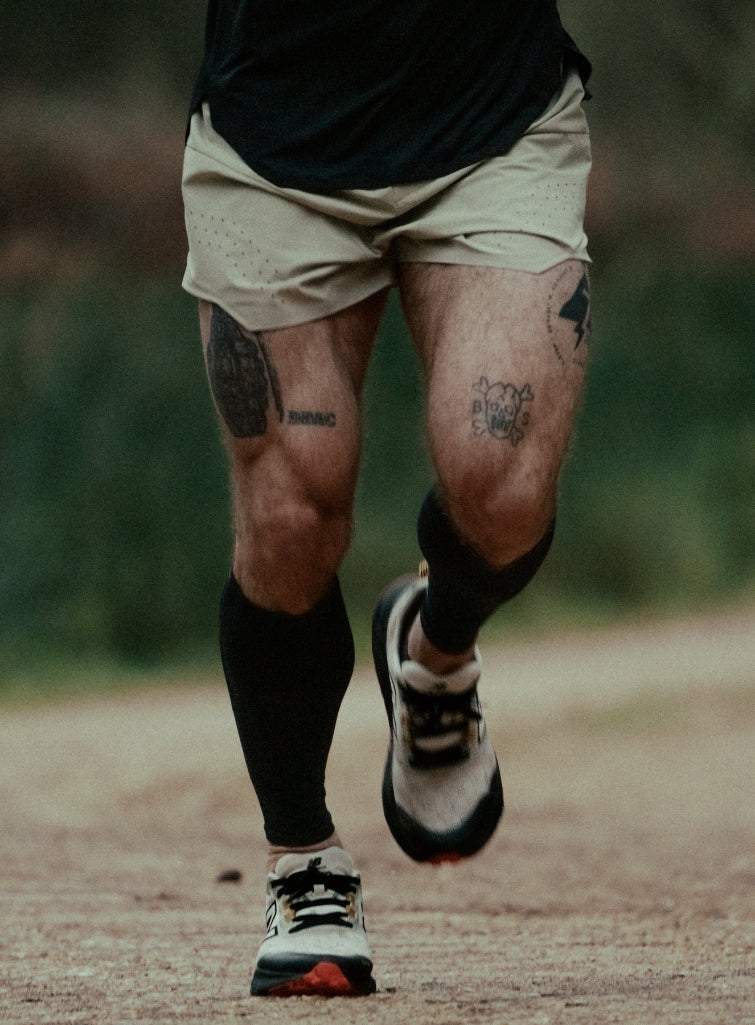 An in the field image of Force Trail Running 4” Shorts in Stone (ITF)