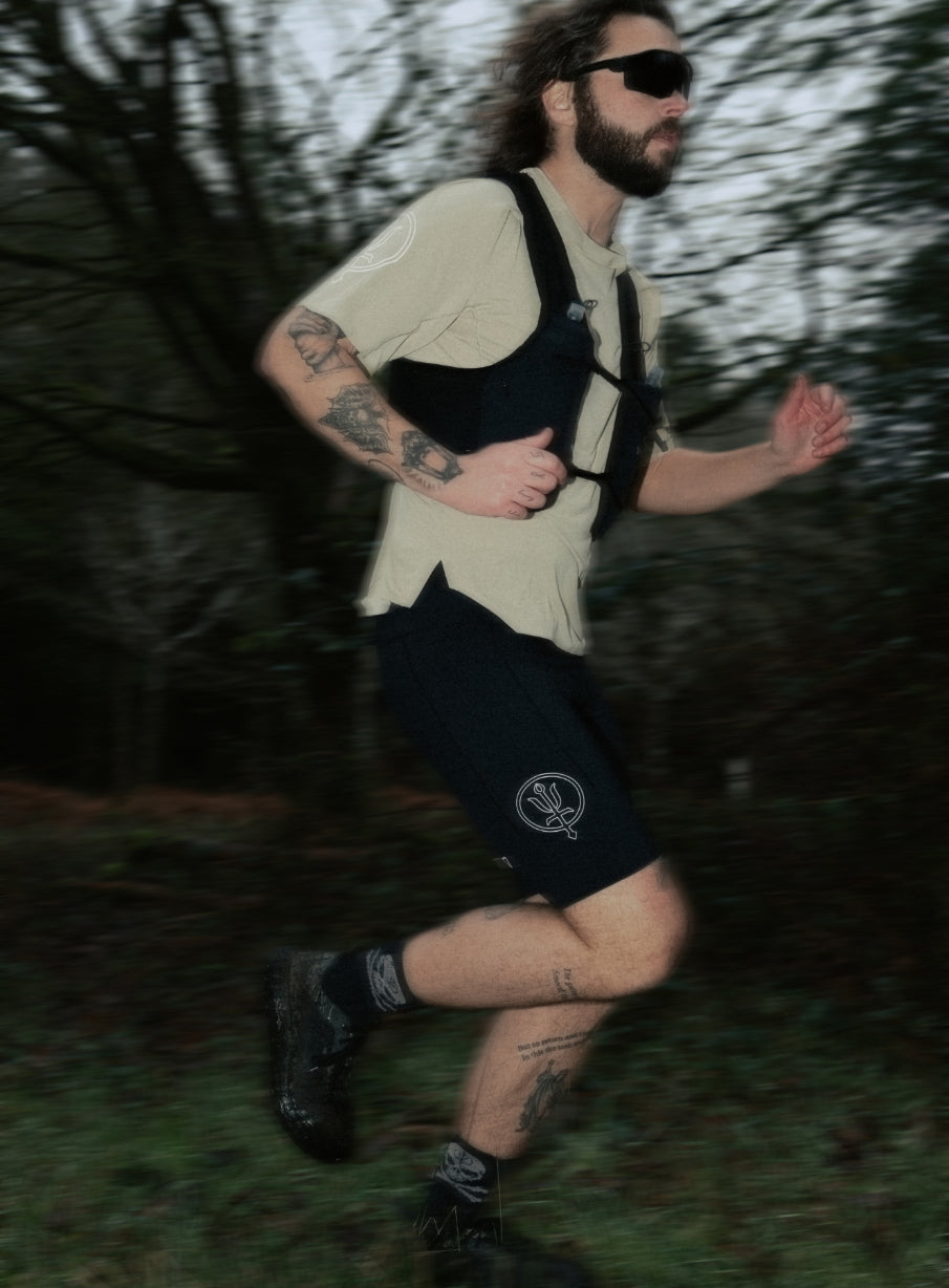 An in the field image of Force Trail Running Tight Shorts in Obsidian Black (ITF)