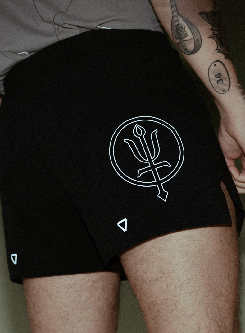 A creative studio shot of Force Trail Running 4” Shorts in Obsidian Black (CS)