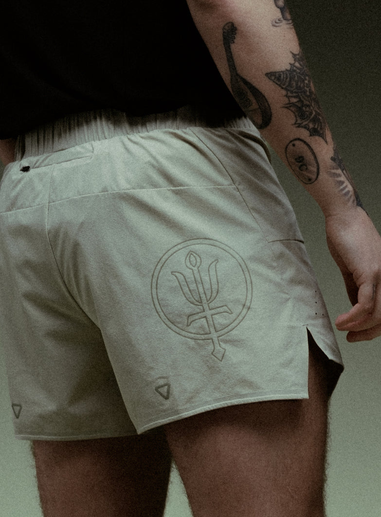 An in the field image of Force Trail Running 4” Shorts in Stone (ITF)