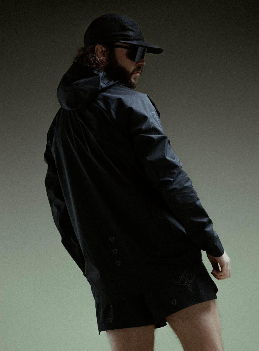 A creative studio shot of Force Trail Running Jacket in Obsidian Black (CS)