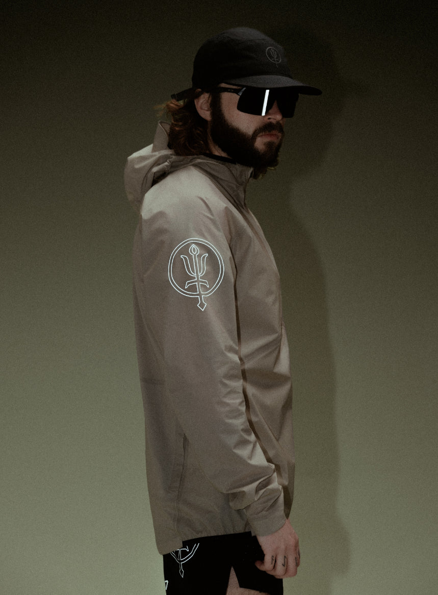 A creative studio shot of Force Trail Running Jacket in Stone (CS)