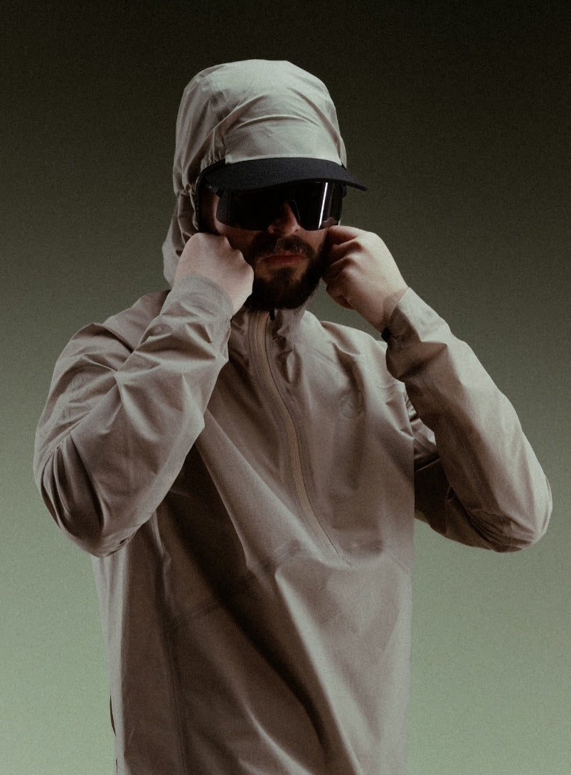 A creative studio shot of Force Trail Running Jacket in Stone (CS)