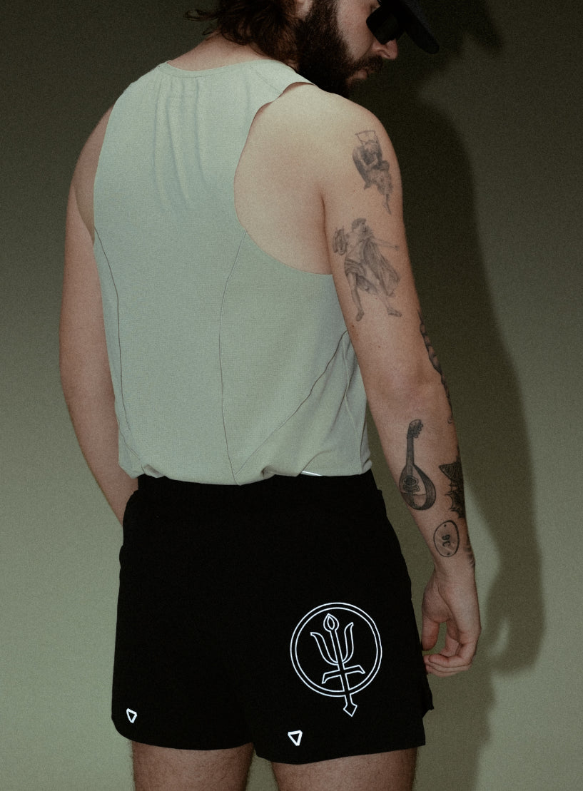 A creative studio shot of Force Trail Running Singlet in Stone (CS)