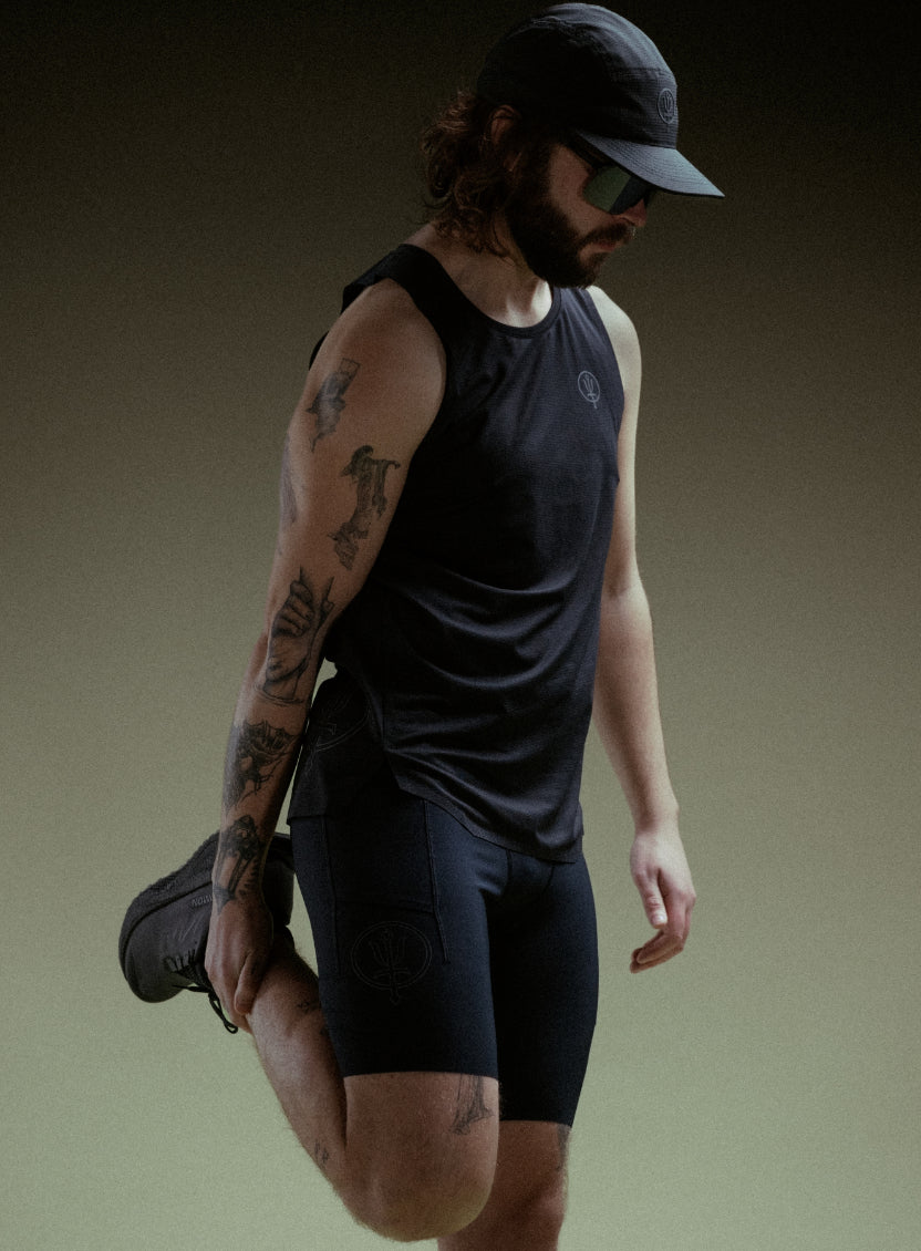 A creative studio shot of Force Trail Running Singlet in Obsidian Black (CS)