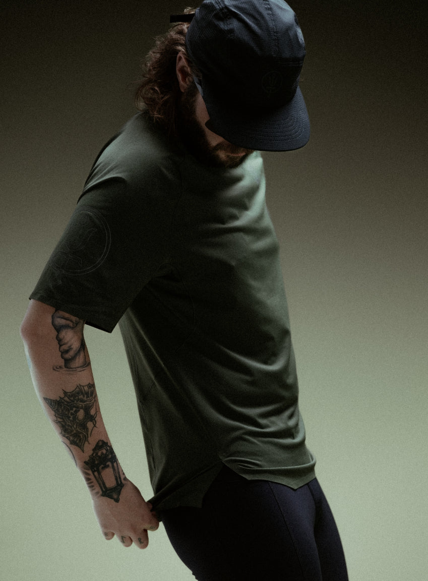 A creative studio shot of Force Trail Running T-Shirt in Forest Green (CS)
