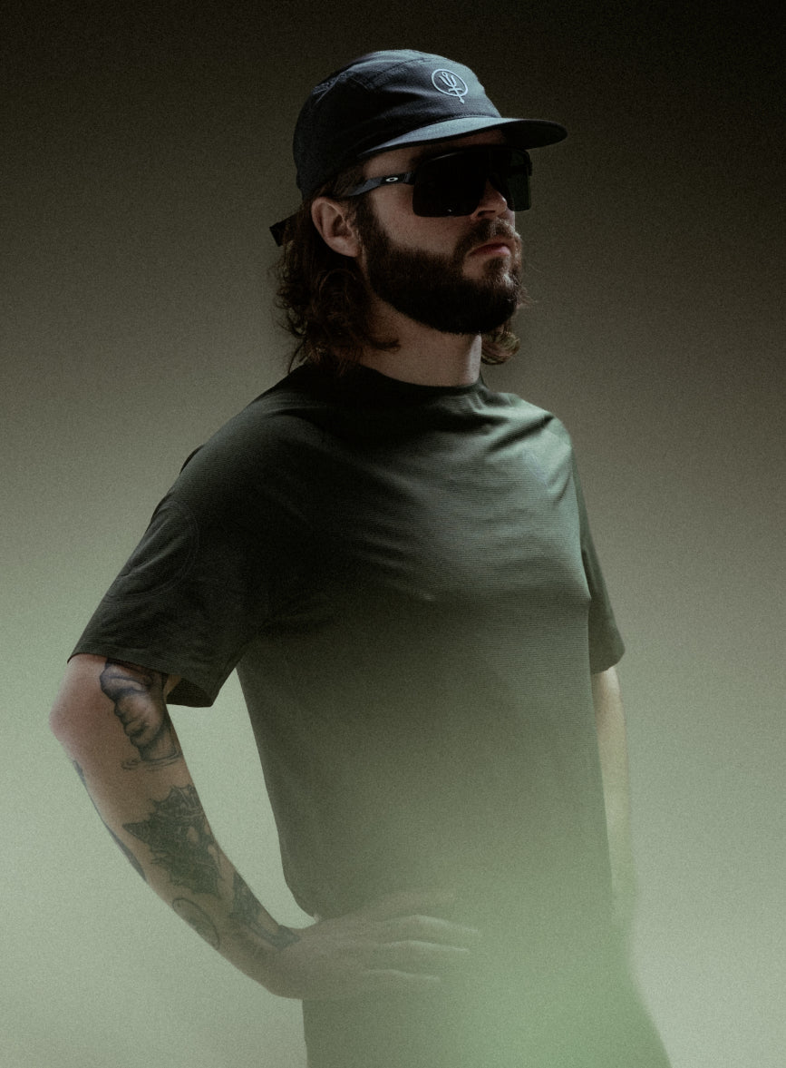 A creative studio shot of Force Trail Running T-Shirt in Forest Green (CS)