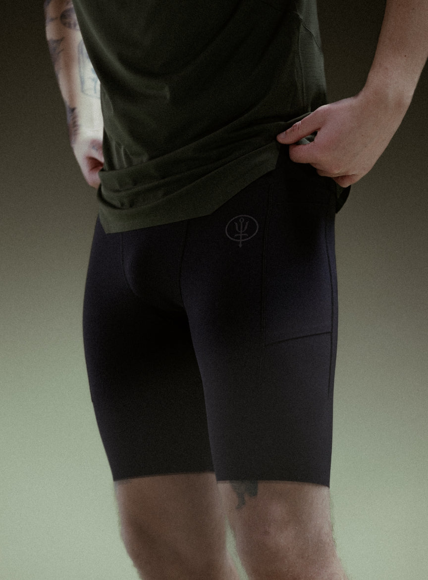 An in the field image of Force Trail Running Tight Shorts in Obsidian Black (ITF)