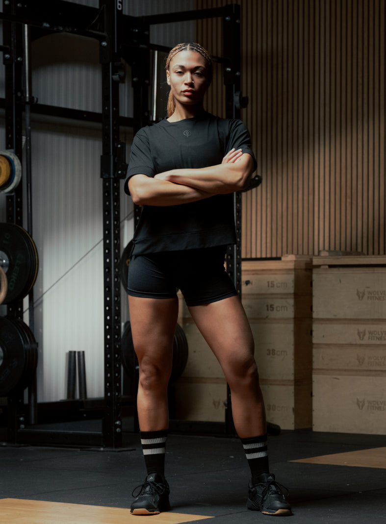 An in the field image of Women's Force Boxy DriRelease T-Shirt in Obsidian Black (ITF)