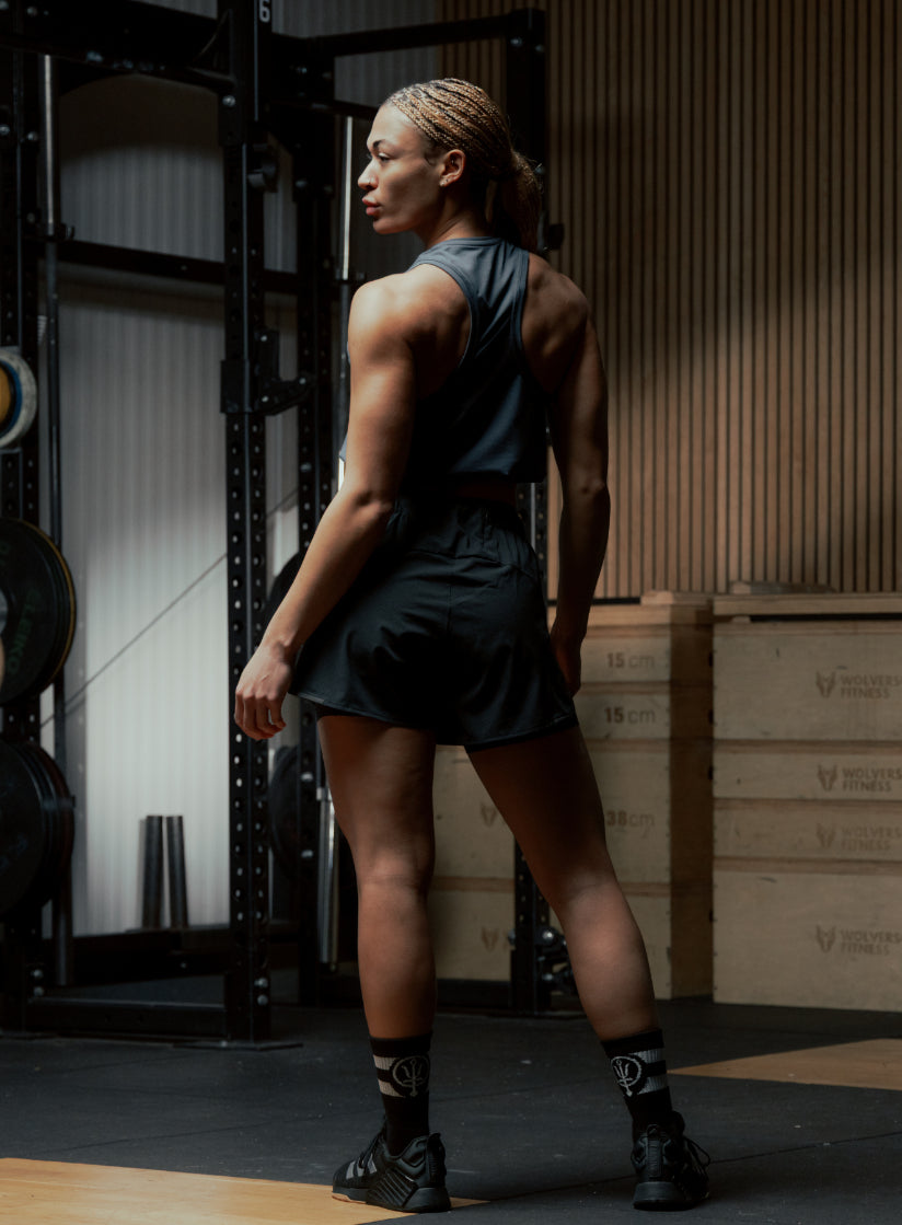 An in the field image of Women's Force 2-In-1 Shorts in Obsidian Black (ITF)