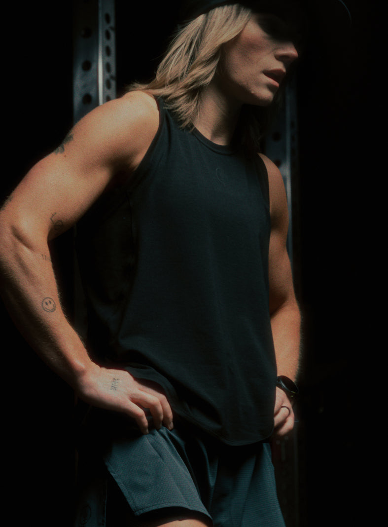 An in the field image of Women's Force DriRelease Tank Vest in Obsidian Black (ITF)