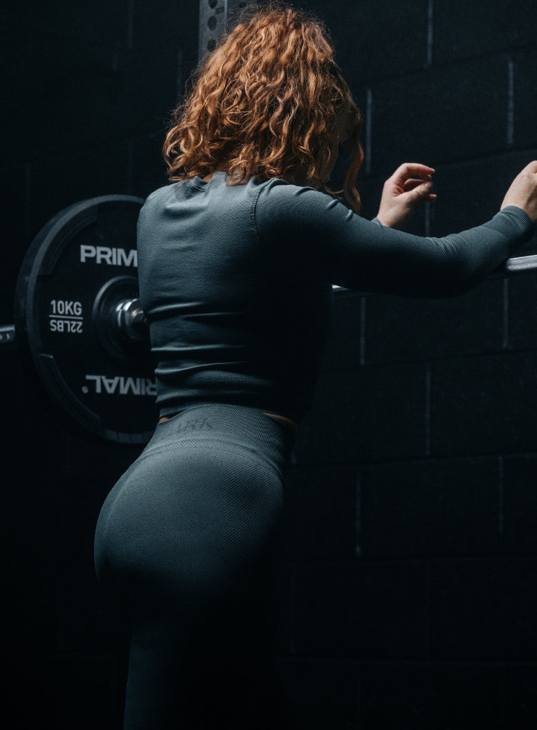 An in the field image of Women's Force Seamless Leggings in Urban Green (ITF)