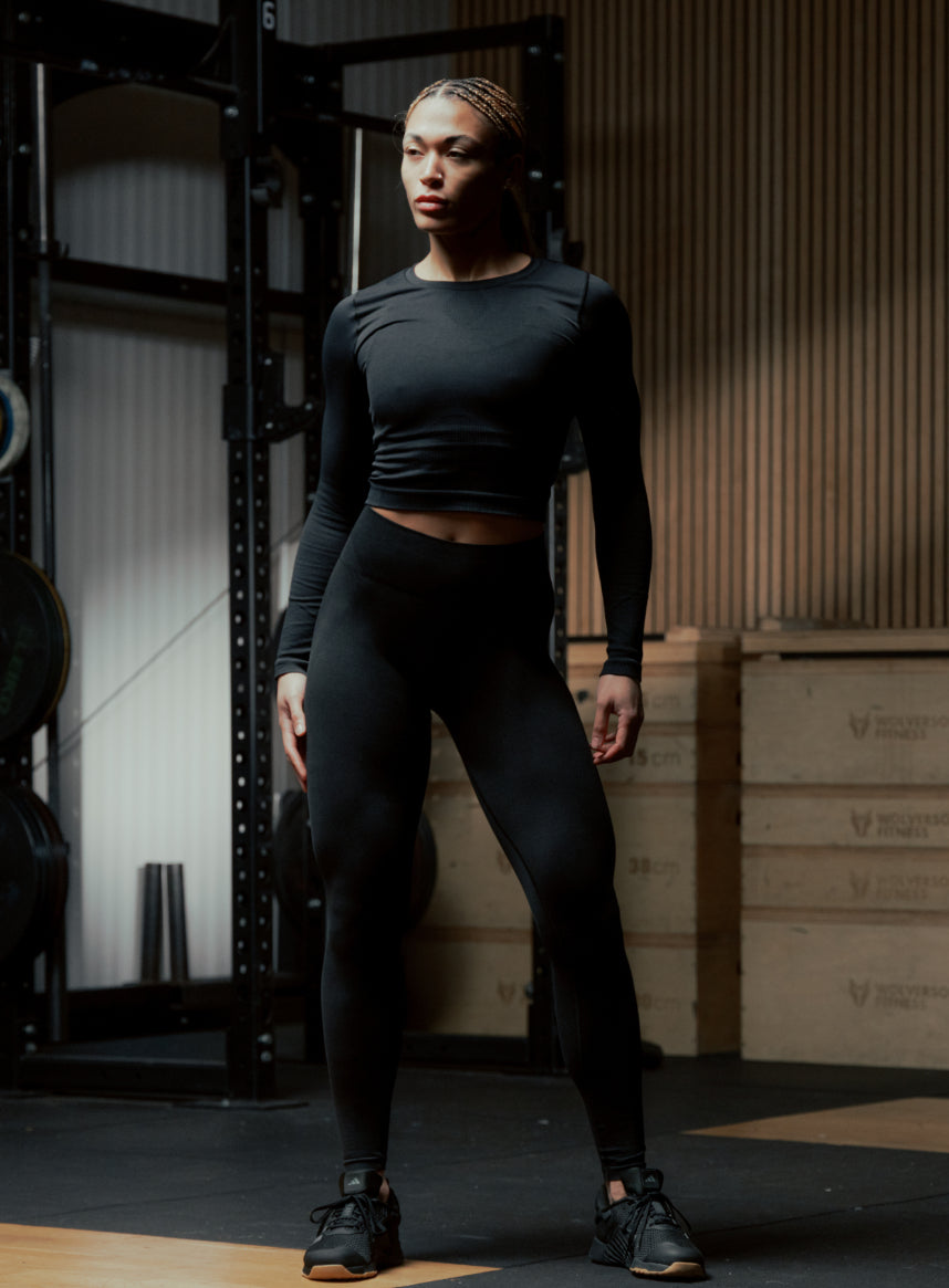 An in the field image of Women's Force Seamless Leggings in Obsidian Black (ITF)