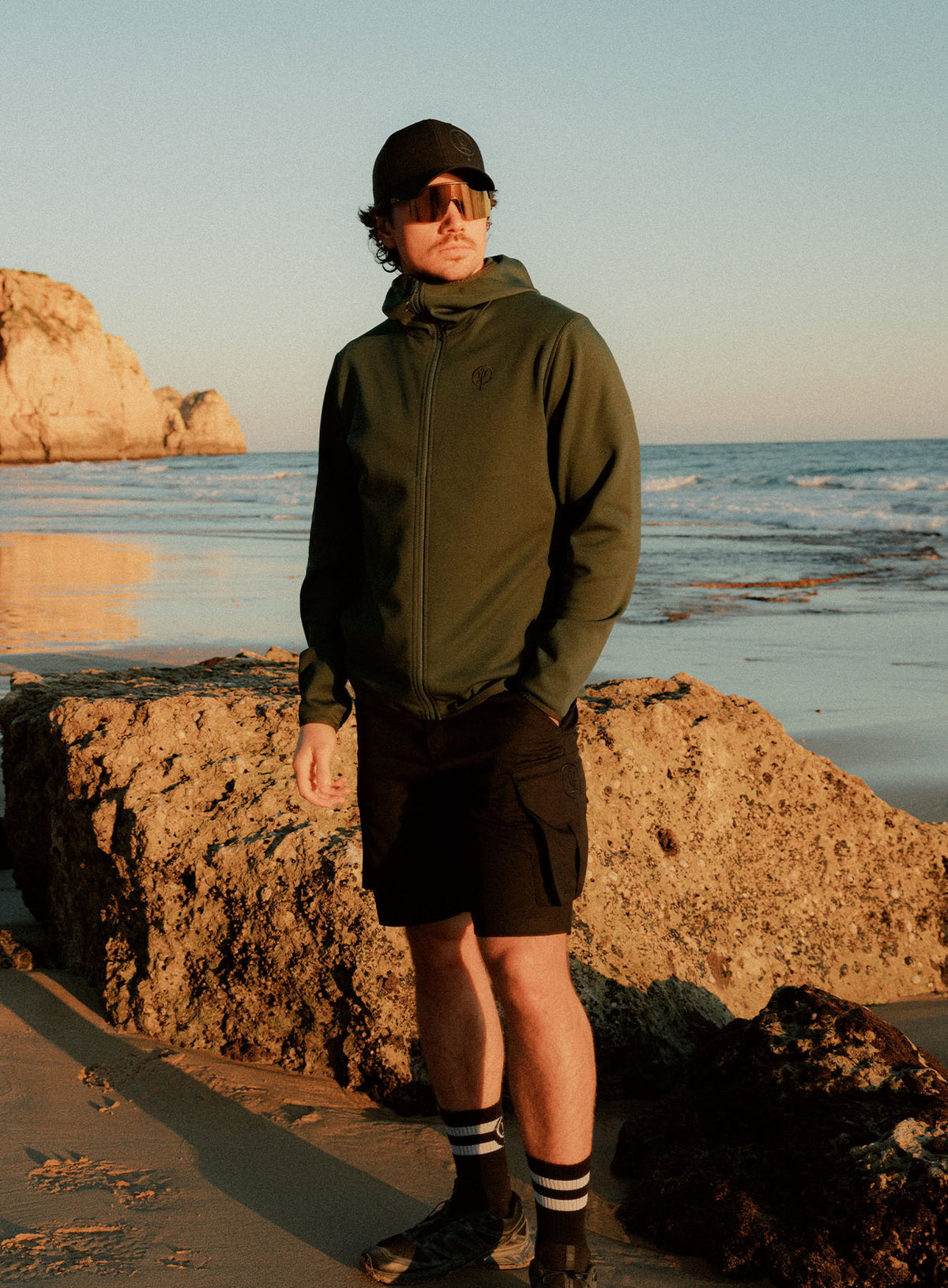 An in the field image of Forward Hoodie in Forest Green (ITF)