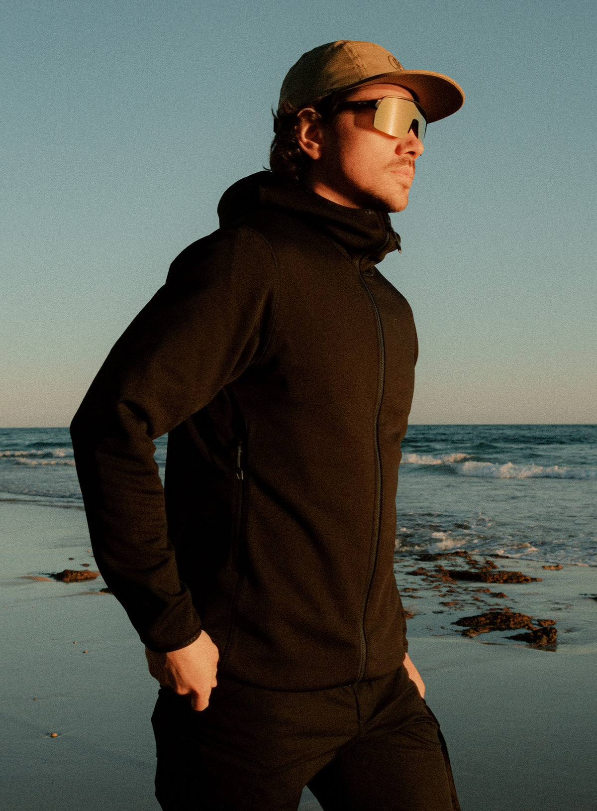 An in the field image of Forward Hoodie in Obsidian Black (ITF)
