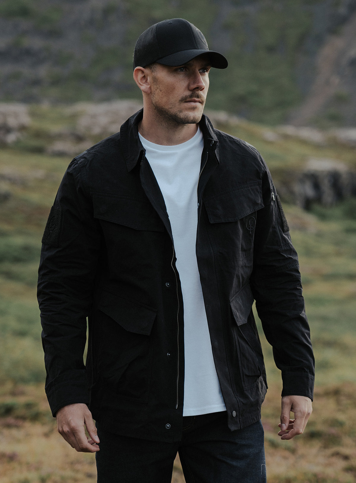 An in the field image of Hybrid Jacket in Obsidian Black (ITF)