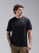 Jack Is 6ft 3" And Wears Size: L | Hem Studio Image Of Model Wearing Insignia Short Sleeve T-Shirt In Obsidian Black (SS Model)