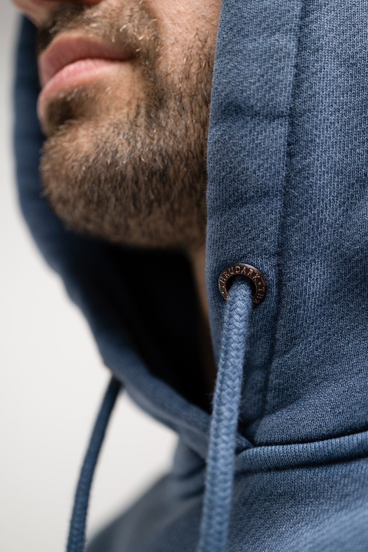 BRANDED METAL EYELET DETAIL