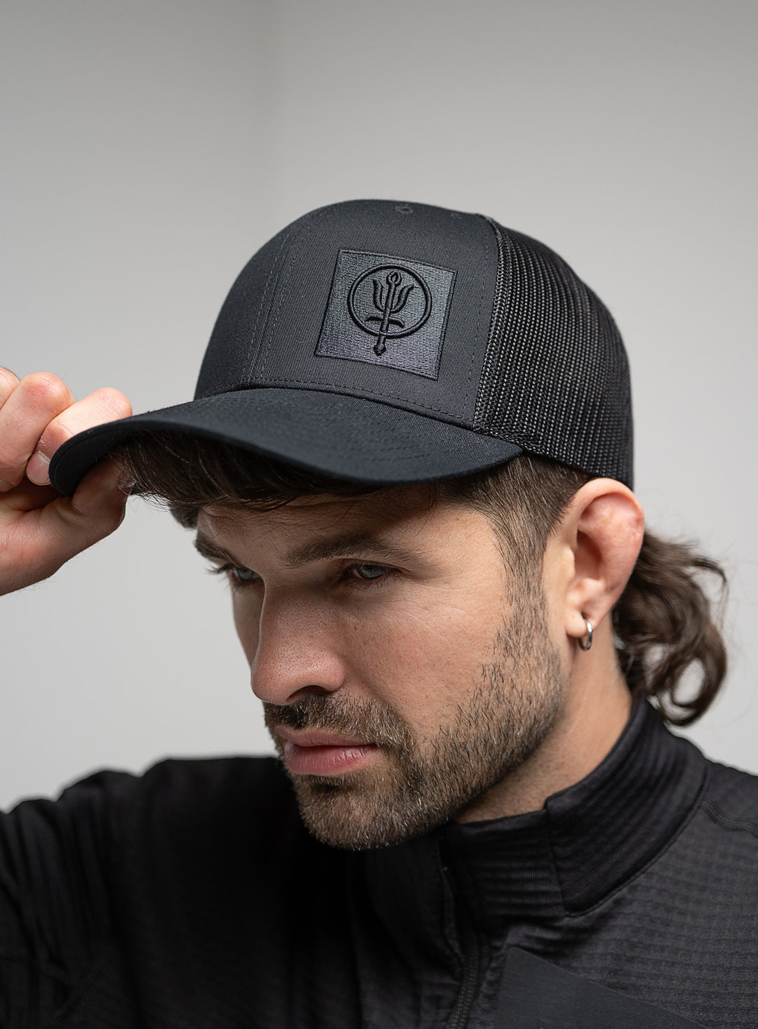 First Mark Cap Black Mark Trucker Cap | Black Snap Back Hat with Insignia Logo | ThruDark