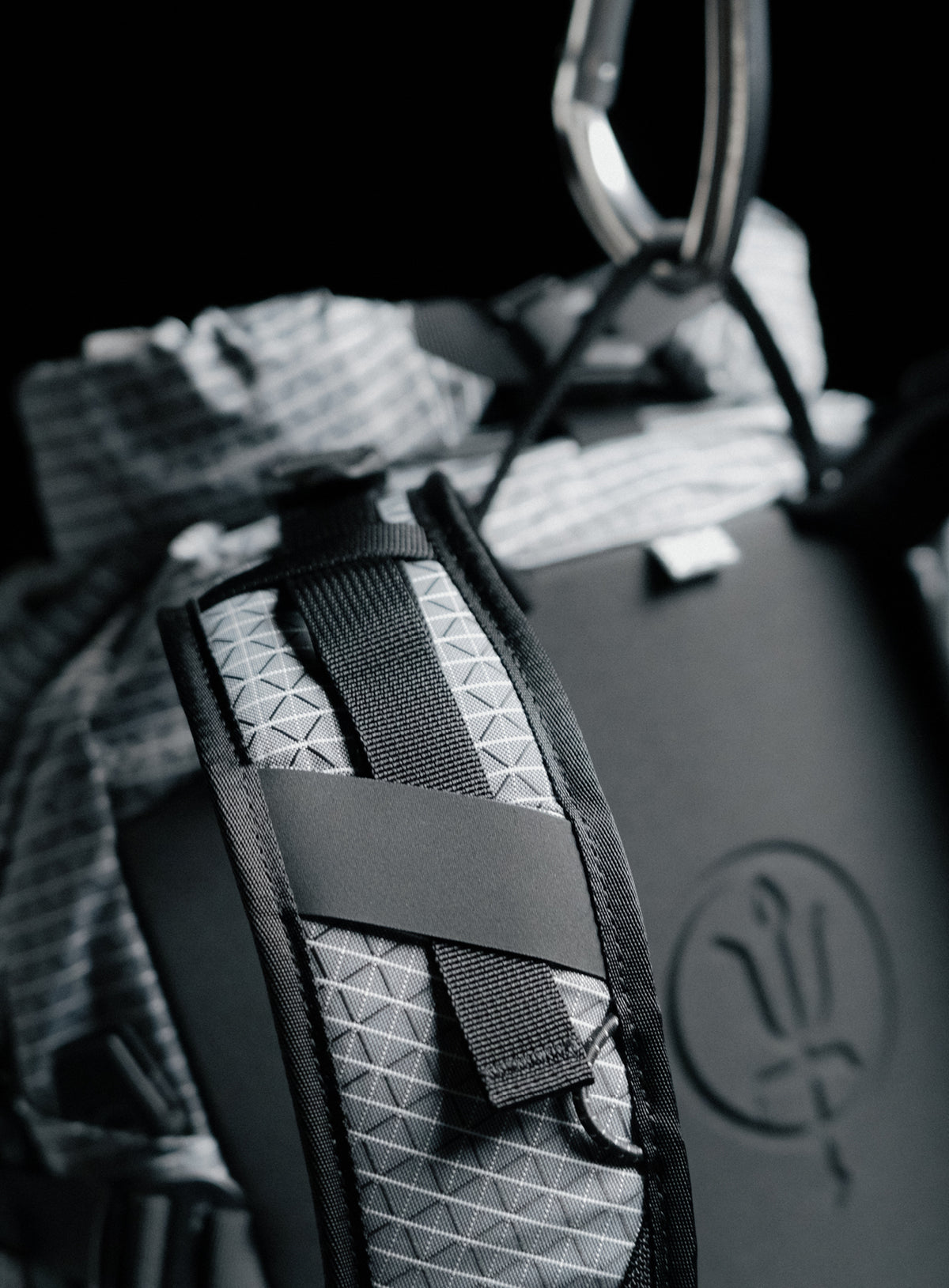 A creative studio shot of Orbital 30L Dyneema Climbing Backpack in Antimony Grey (CS)