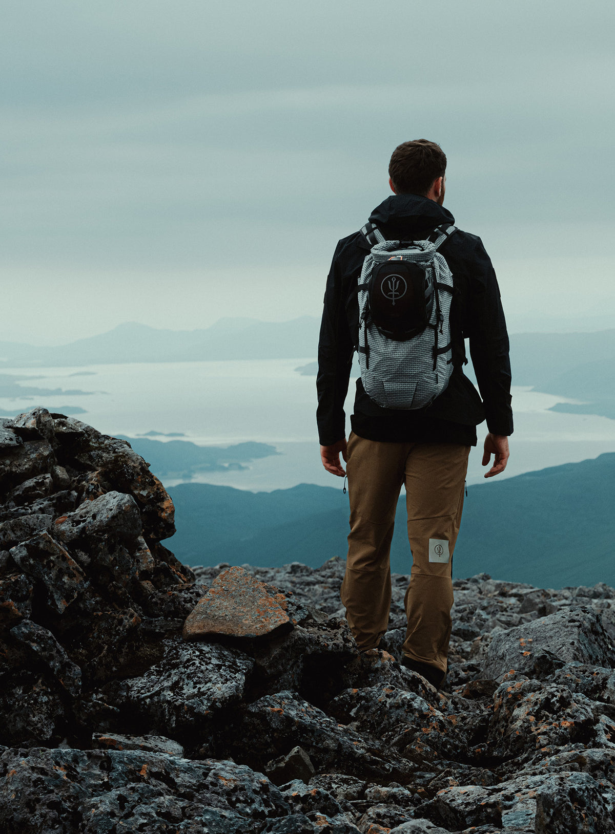 An in the field image of Orbital 30L Dyneema Climbing Backpack in Antimony Grey (ITF)
