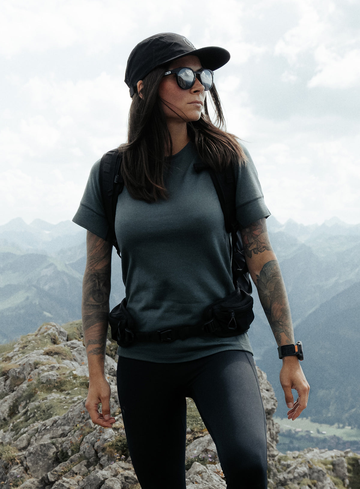 An in the field image of Women's Oryon 72HR Merino T-Shirt in Urban Green (ITF)