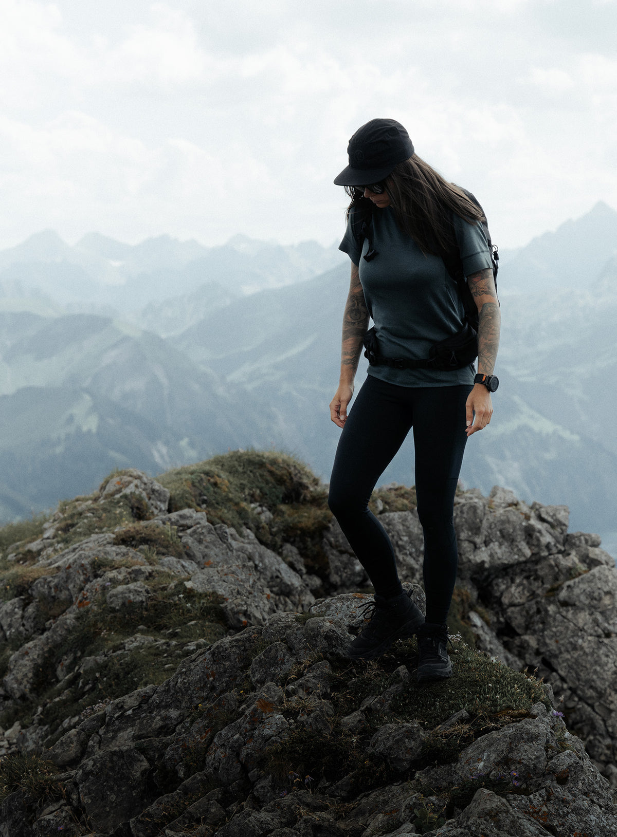 An in the field image of Women's Oryon 72HR Merino T-Shirt in Urban Green (ITF)