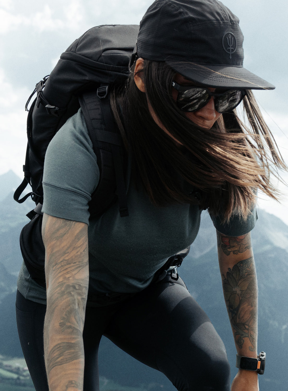 An in the field image of Women's Oryon 72HR Merino T-Shirt in Urban Green (ITF)