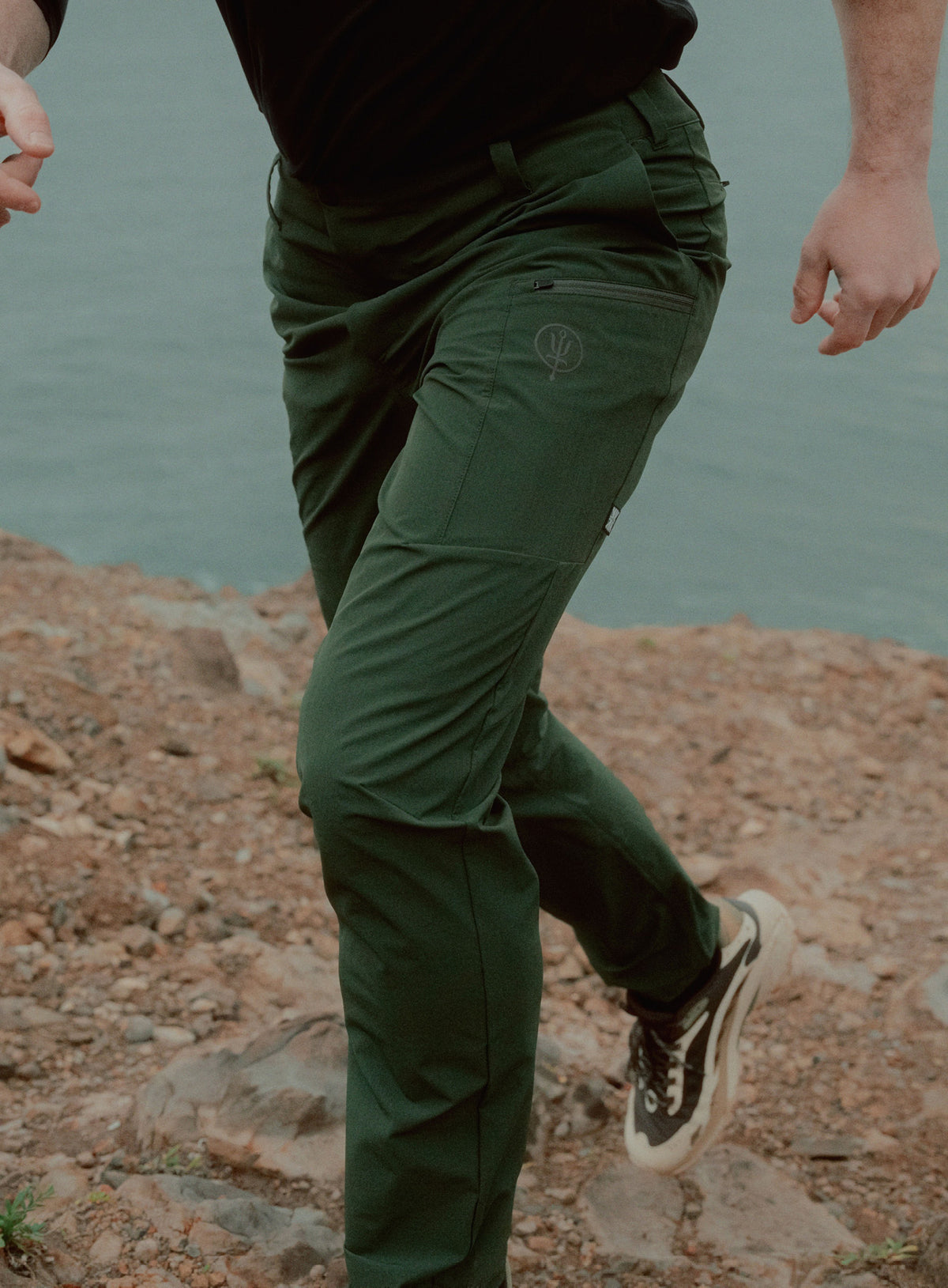 An in the field image of Oryon Trousers in Forest Green (ITF)