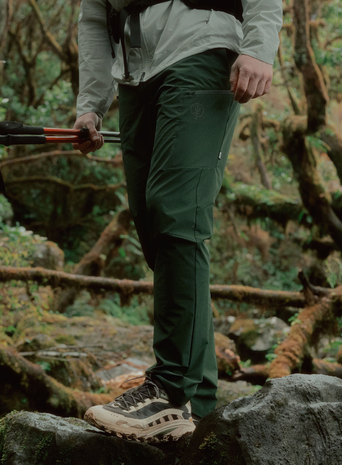 An in the field image of Oryon Trousers in Forest Green (ITF)