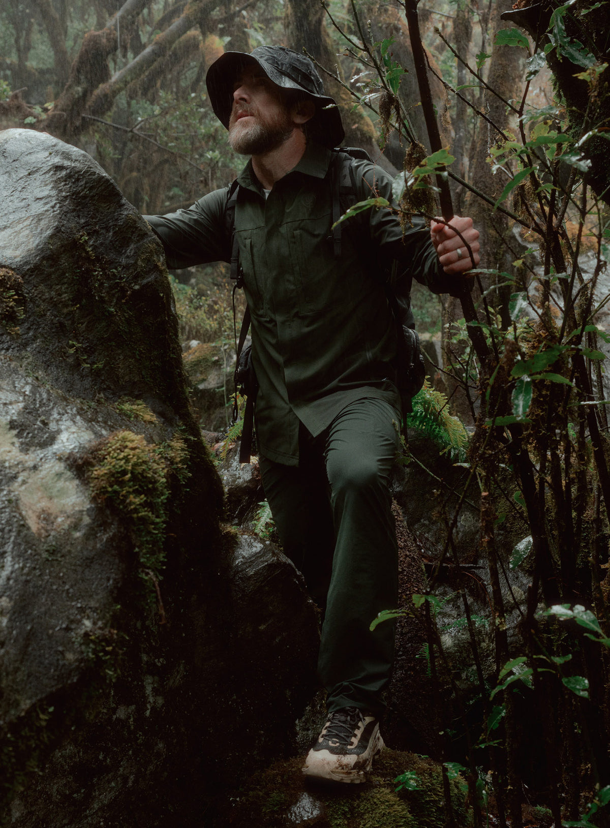 An in the field image of Oryon Trousers in Forest Green (ITF)