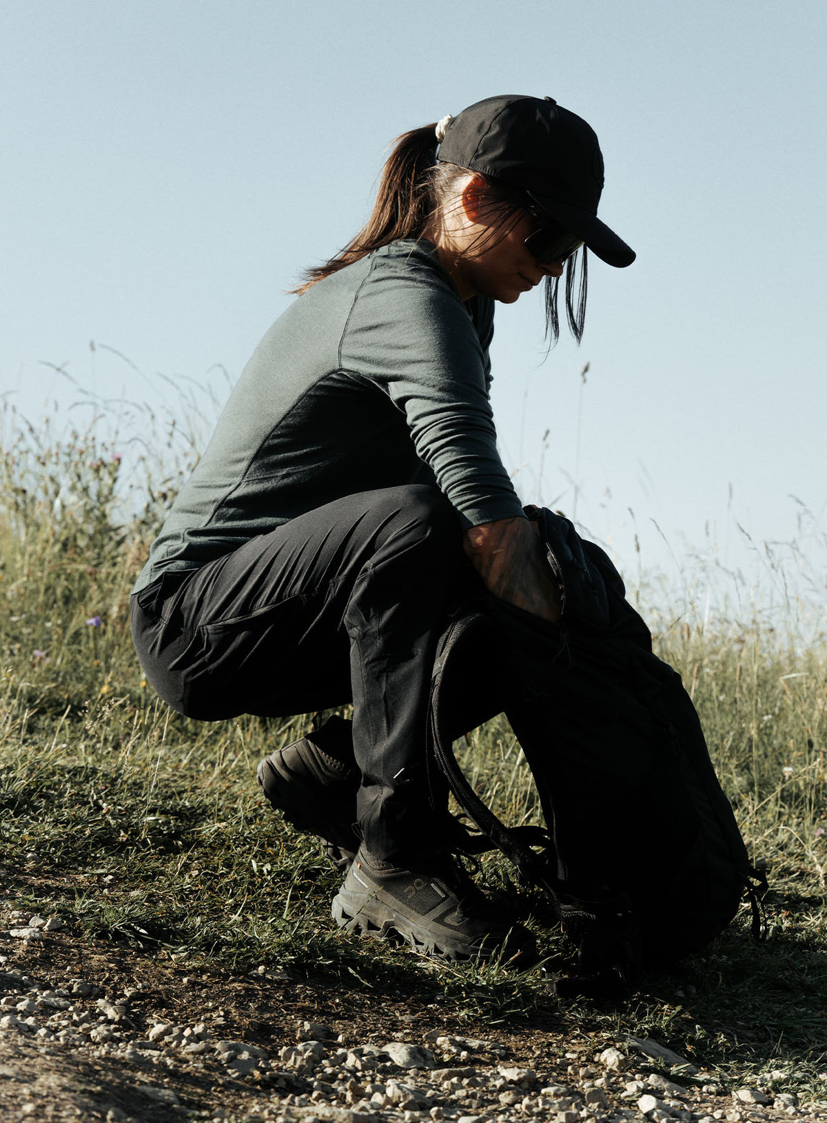An in the field image of Women's Oryon Trousers in Obsidian Black (ITF)