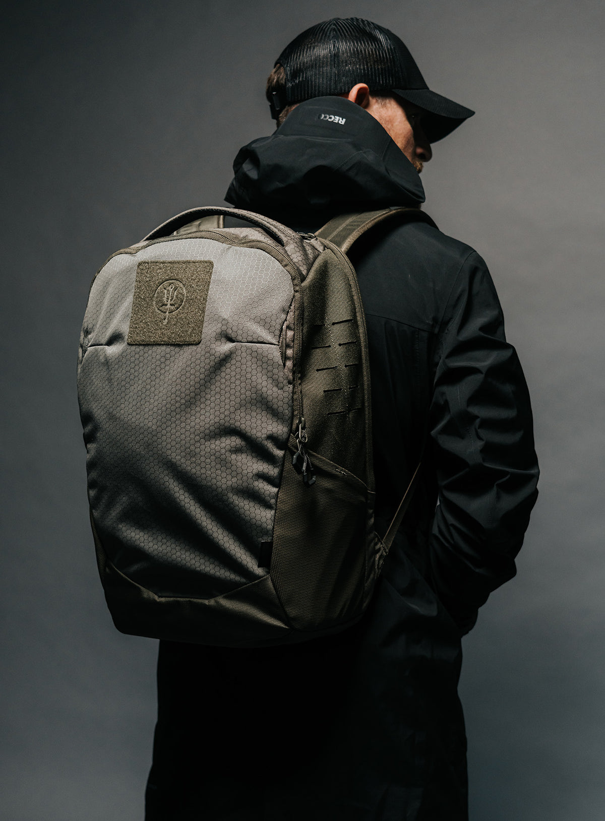 A creative studio shot of Phantom 25L Backpack in Olive Green (CS)