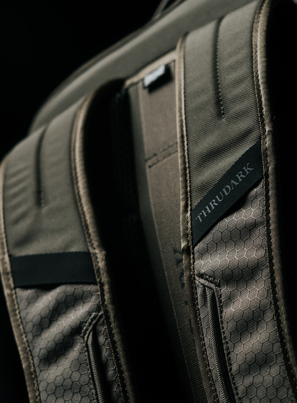 A creative studio shot of Phantom 25L Backpack in Olive Green (CS)