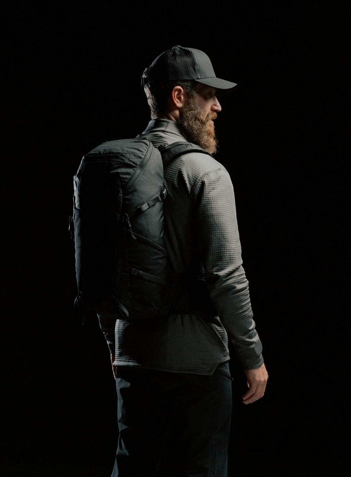 A creative studio shot of Pinnacle 28L Hiking Backpack in Obsidian Black (CS)