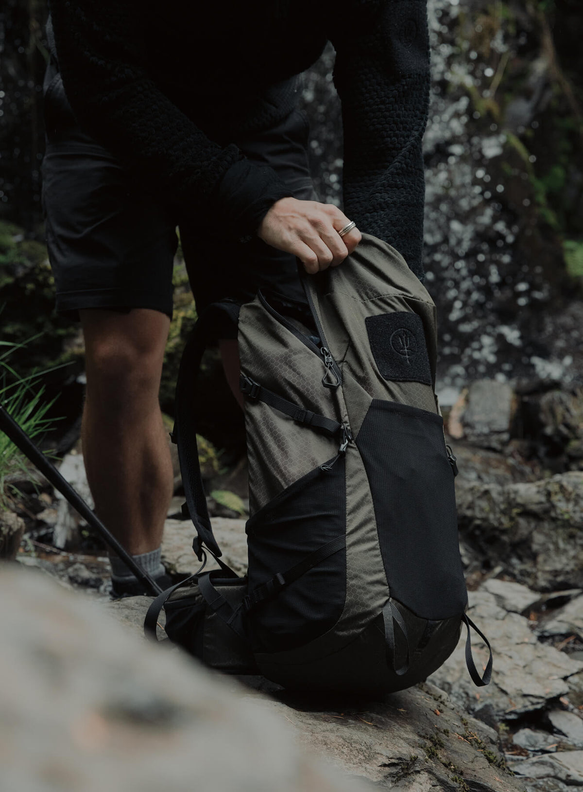 An in the field image of Pinnacle 28L Hiking Backpack in Olive Green (ITF)