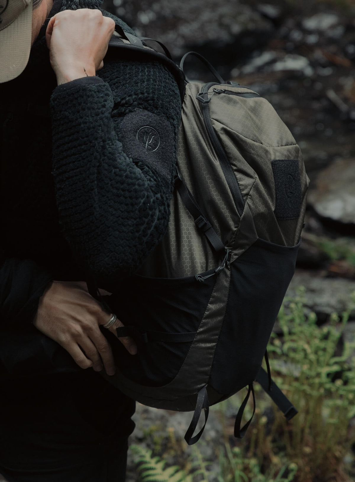 An in the field image of Pinnacle 28L Hiking Backpack in Olive Green (ITF)