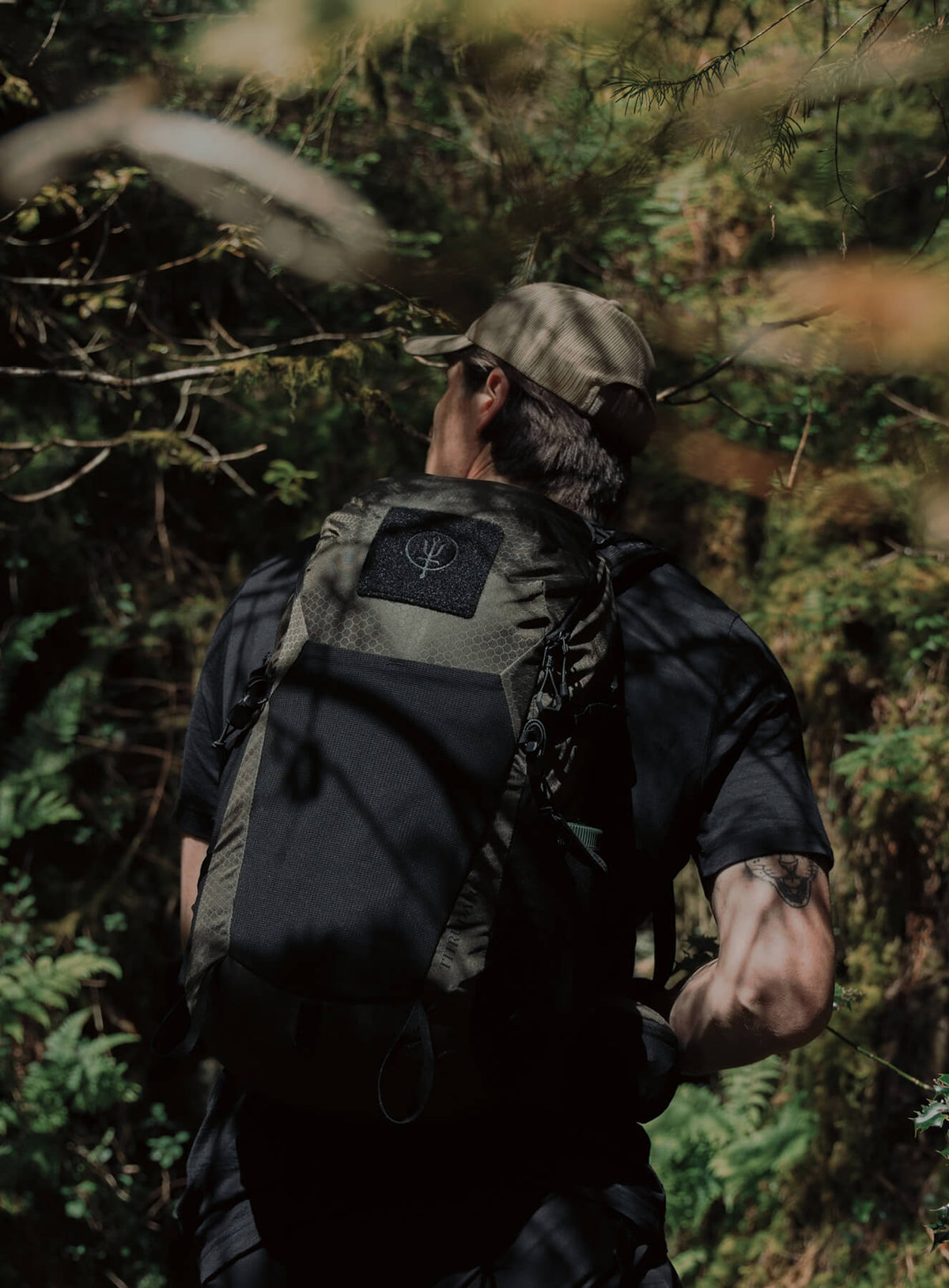 An in the field image of Pinnacle 28L Hiking Backpack in Olive Green (ITF)