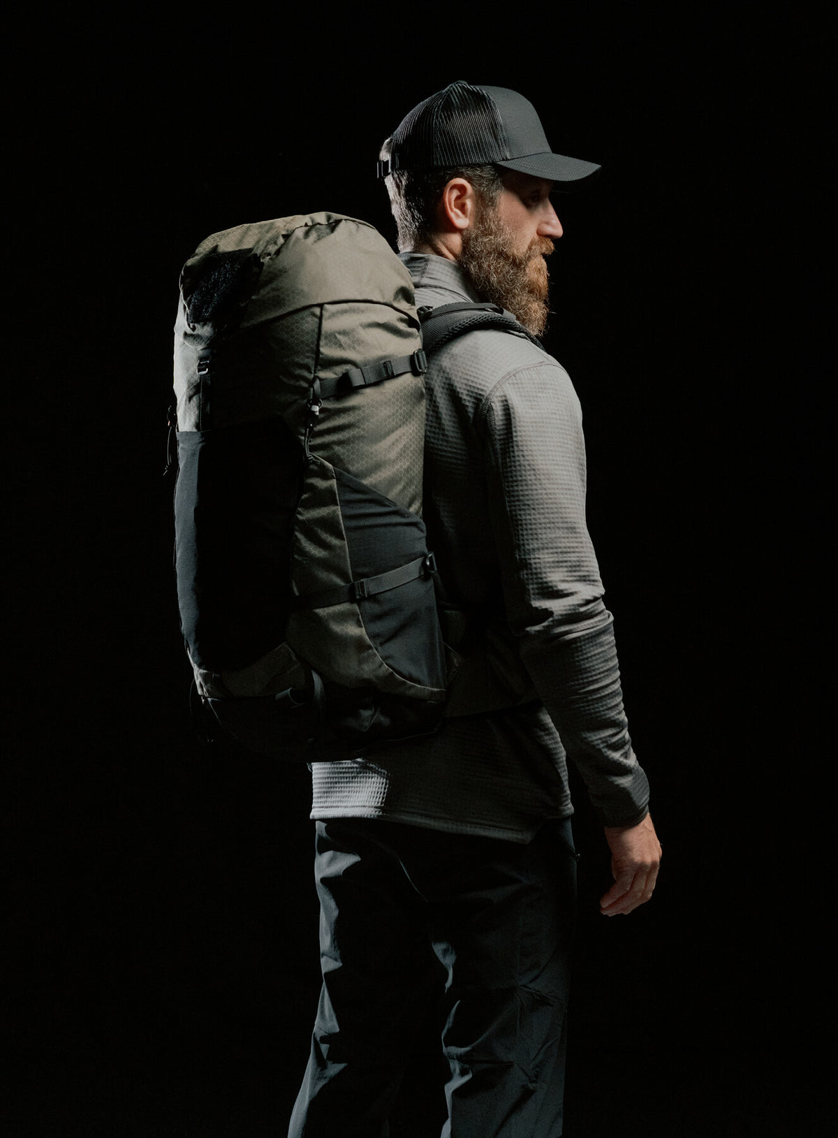 A creative studio shot of Pinnacle 42L Hiking Backpack in Olive Green (CS)