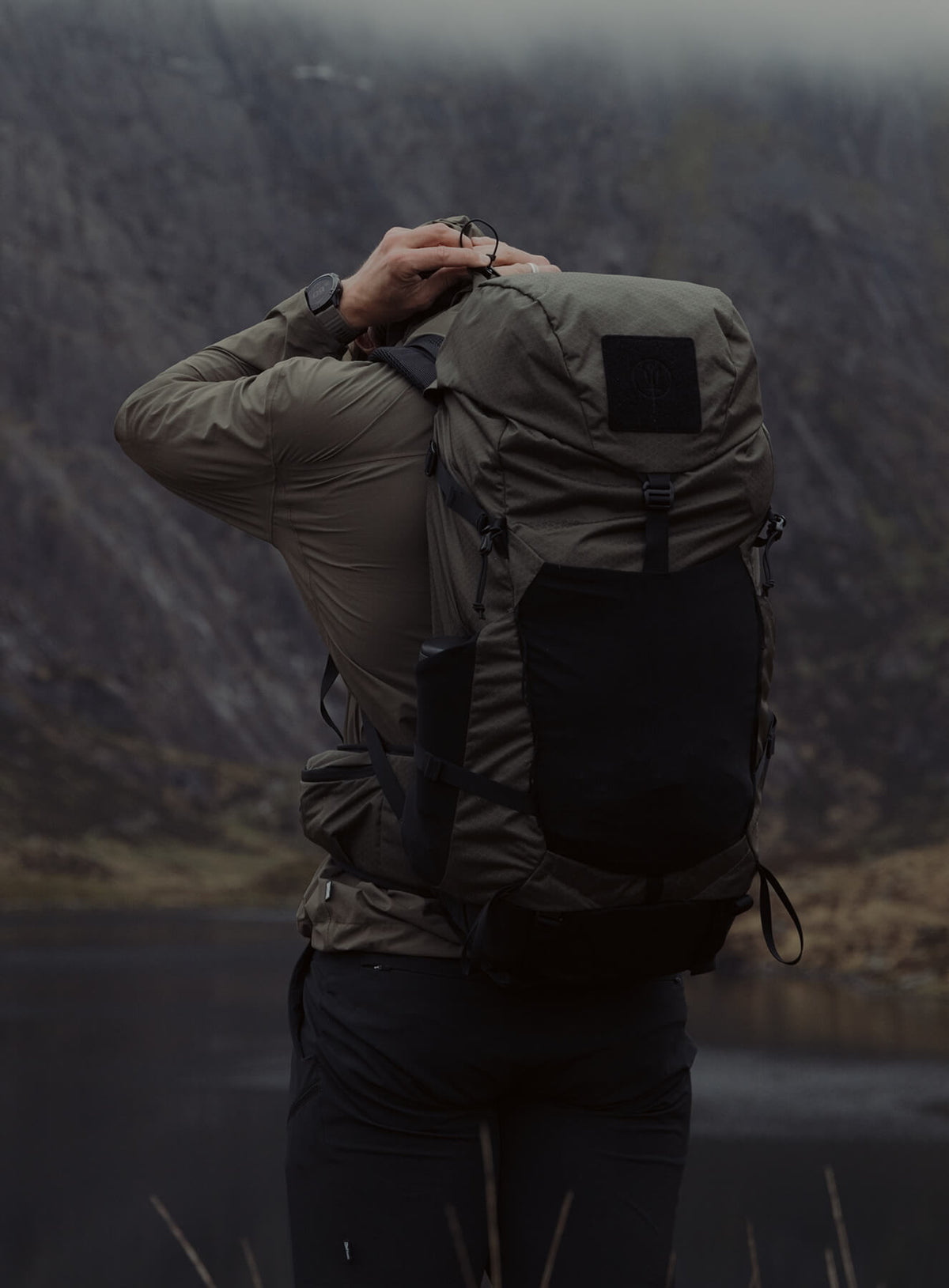 An in the field image of Pinnacle 42L Hiking Backpack in Olive Green (ITF)