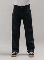 A studio shot of Dissident Selvedge Jeans - Regular in Obsidian Black (SS)