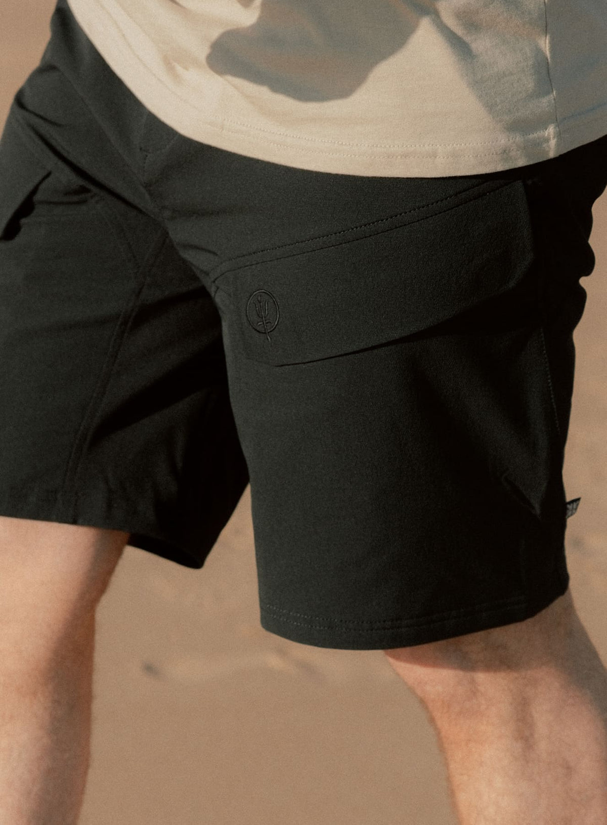 An in the field image of Men's Strike Shorts in Obsidian Black (ITF)