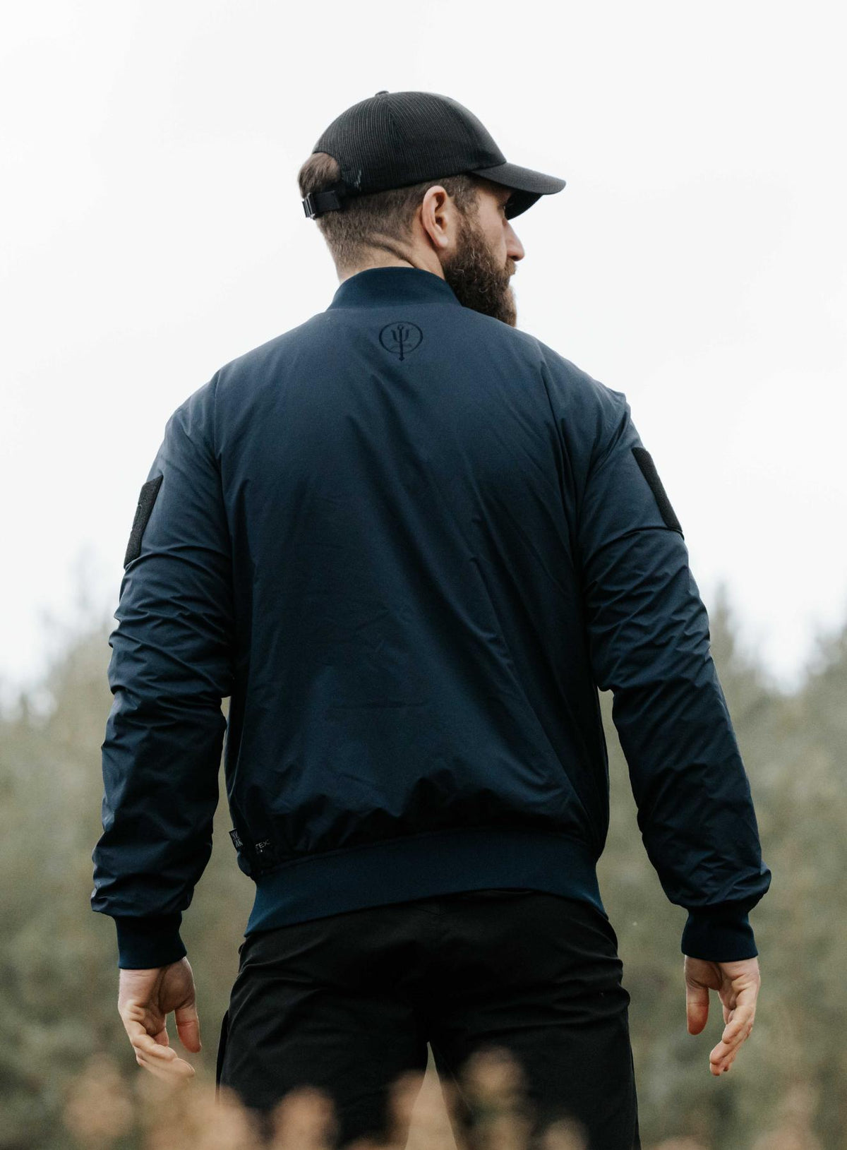 An in the field image of Men's Wraith Bomber Jacket in Dark Sapphire (ITF)