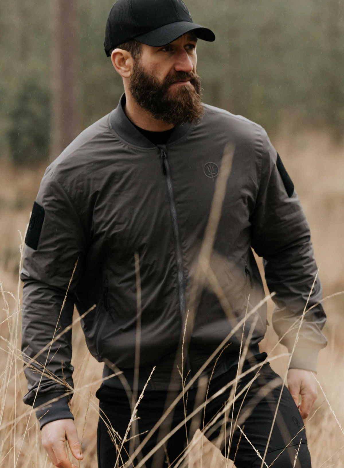An in the field image of Men's Wraith Bomber Jacket in Raven Grey (ITF)