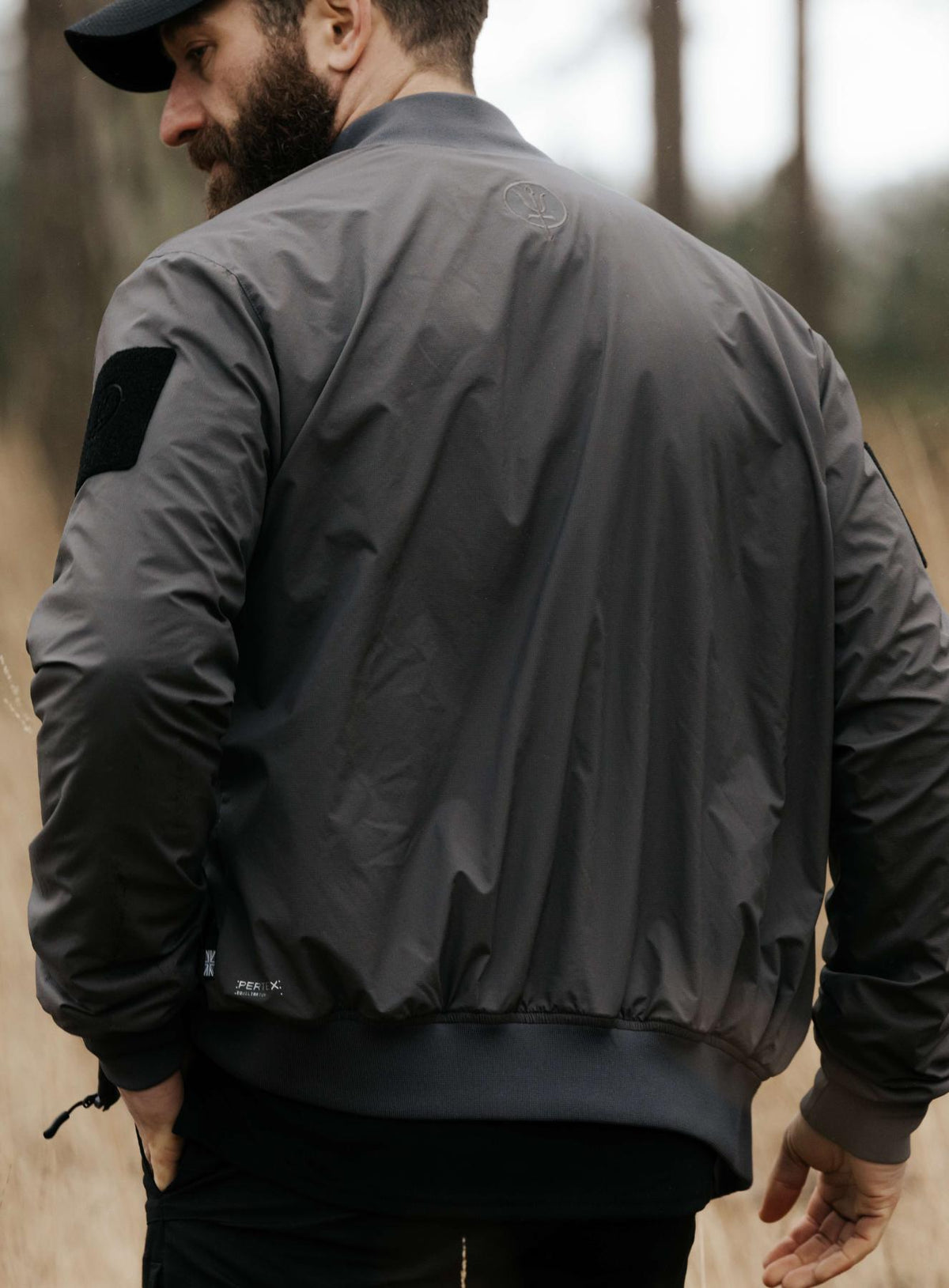 An in the field image of Men's Wraith Bomber Jacket in Raven Grey (ITF)
