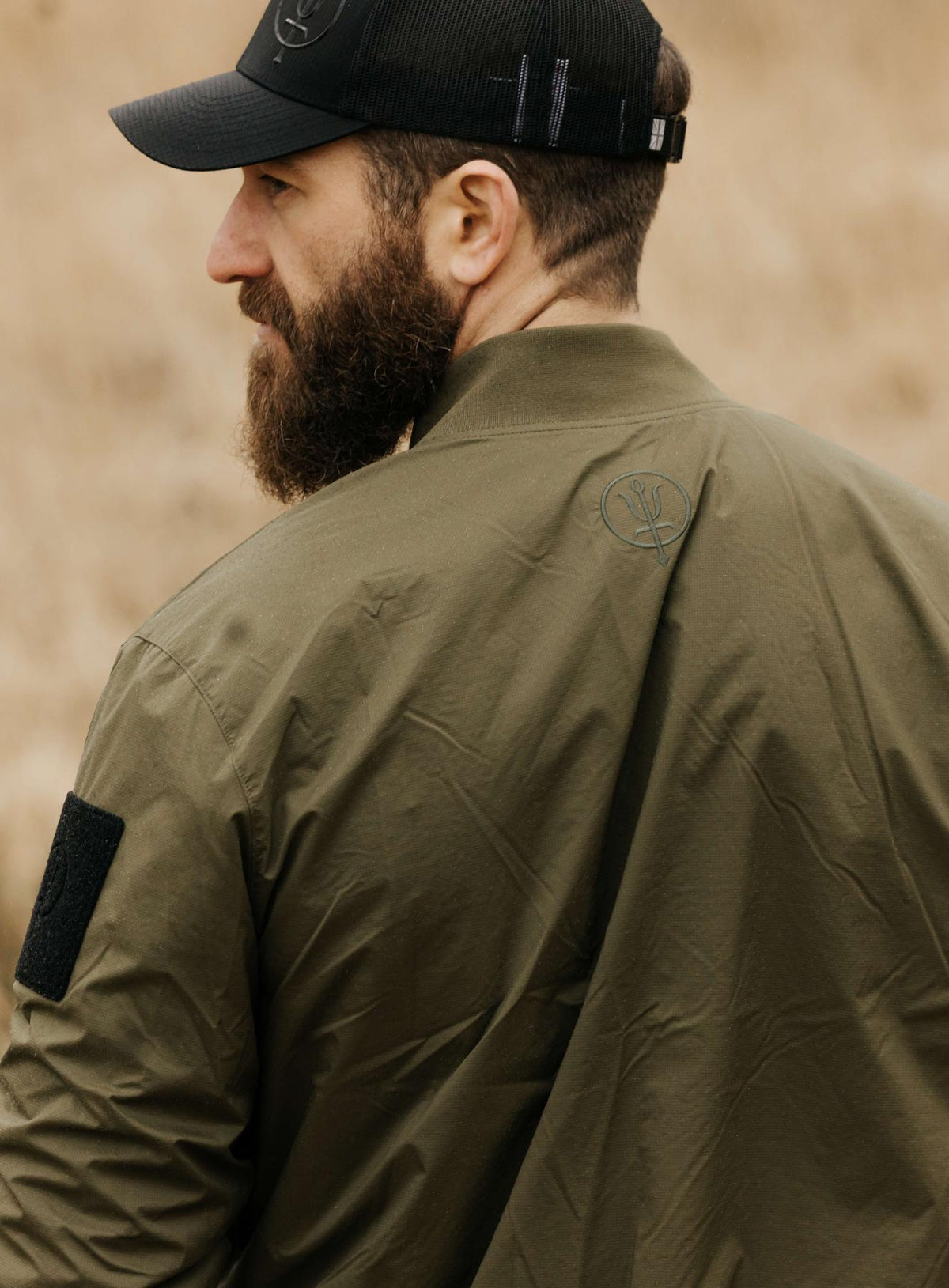 An in the field image of Men's Wraith Bomber Jacket in Khaki (ITF)
